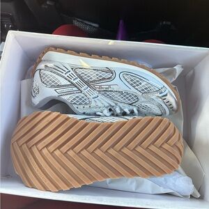 White and Tan Athletic Sneakers with Unique Tread